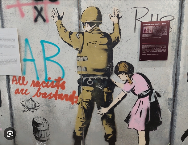 Banksy soldier girl